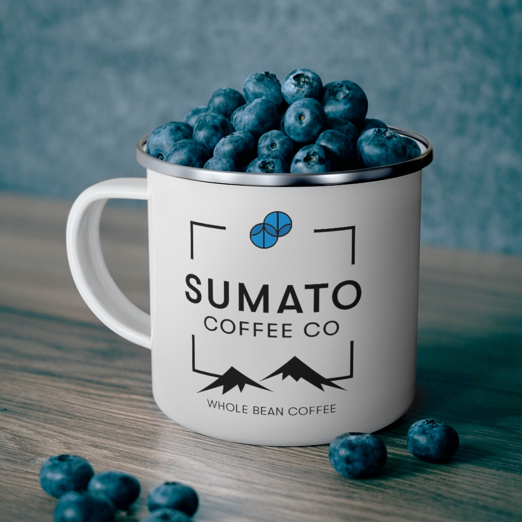 Sumato Coffee Co. enamel mug filled with fresh blueberries on a wooden table – bold, flavorful, and adventure-ready