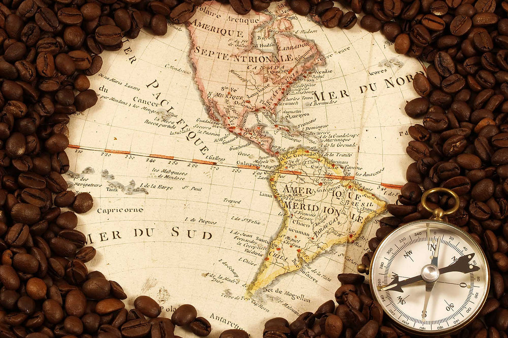 Whole coffee beans surrounding a old-world style global map 