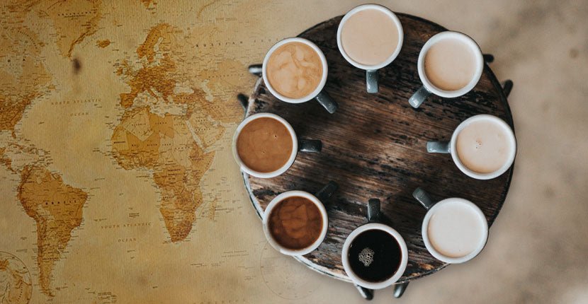 Coffees on a table displayed over a global map.
