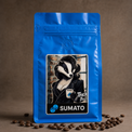 Touch Base Sumato Coffee in a blue bag with roasted coffee beans